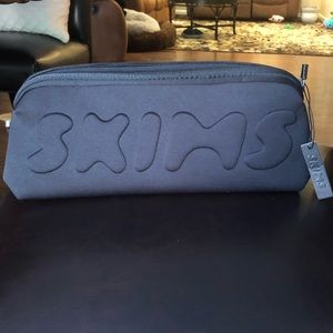 NWOT Skims black cosmetics bag. Never used. New condition.